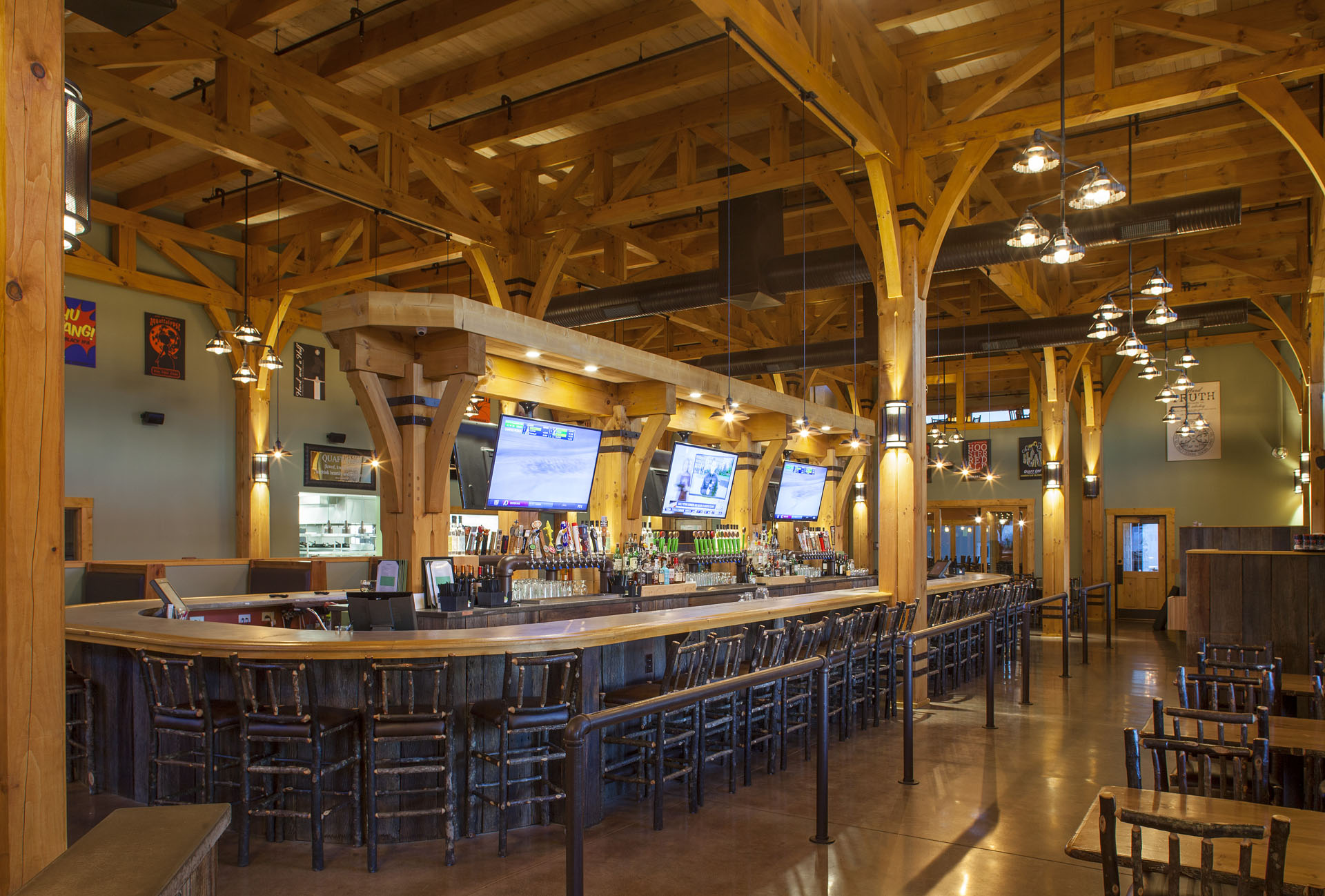 Big Woods Speedway — horseshoe bar under the exposed heavy timber roof