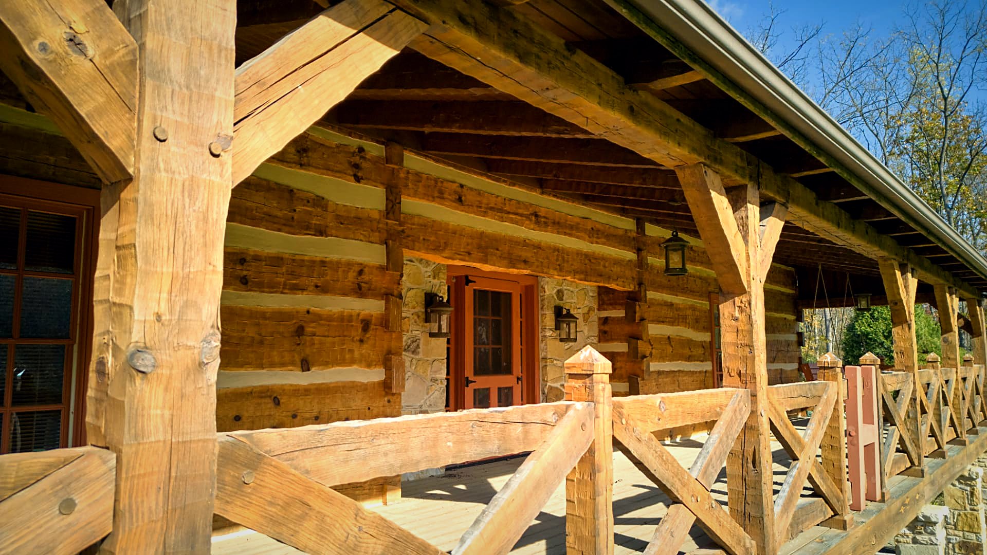 Porch posts and cross-braced railing in raking light