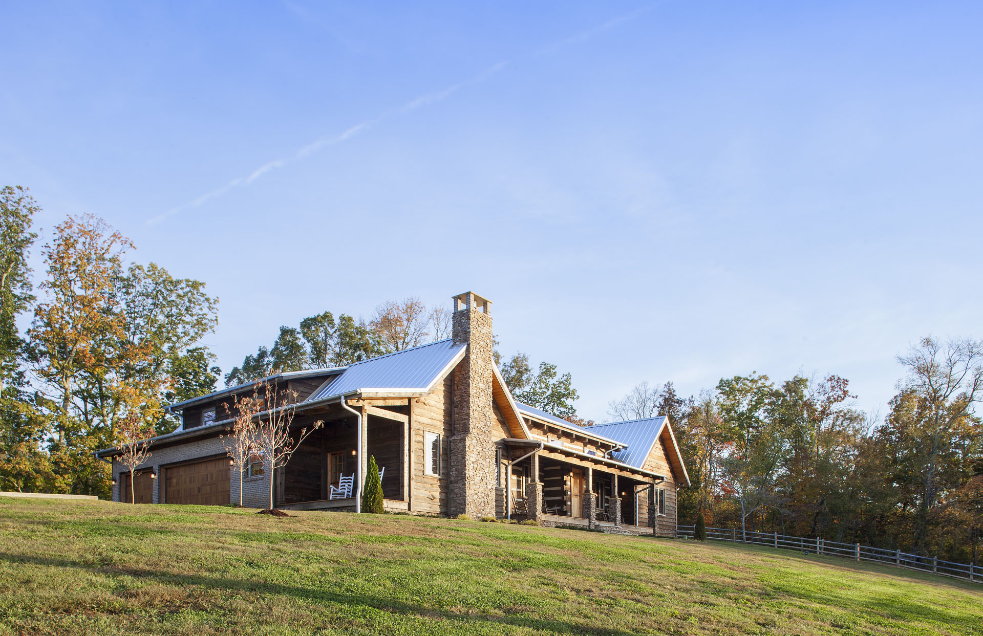 The Tom Thompson, MD Log Home — reclaimed hand-hewn logs, ridgetop pasture, Tennessee