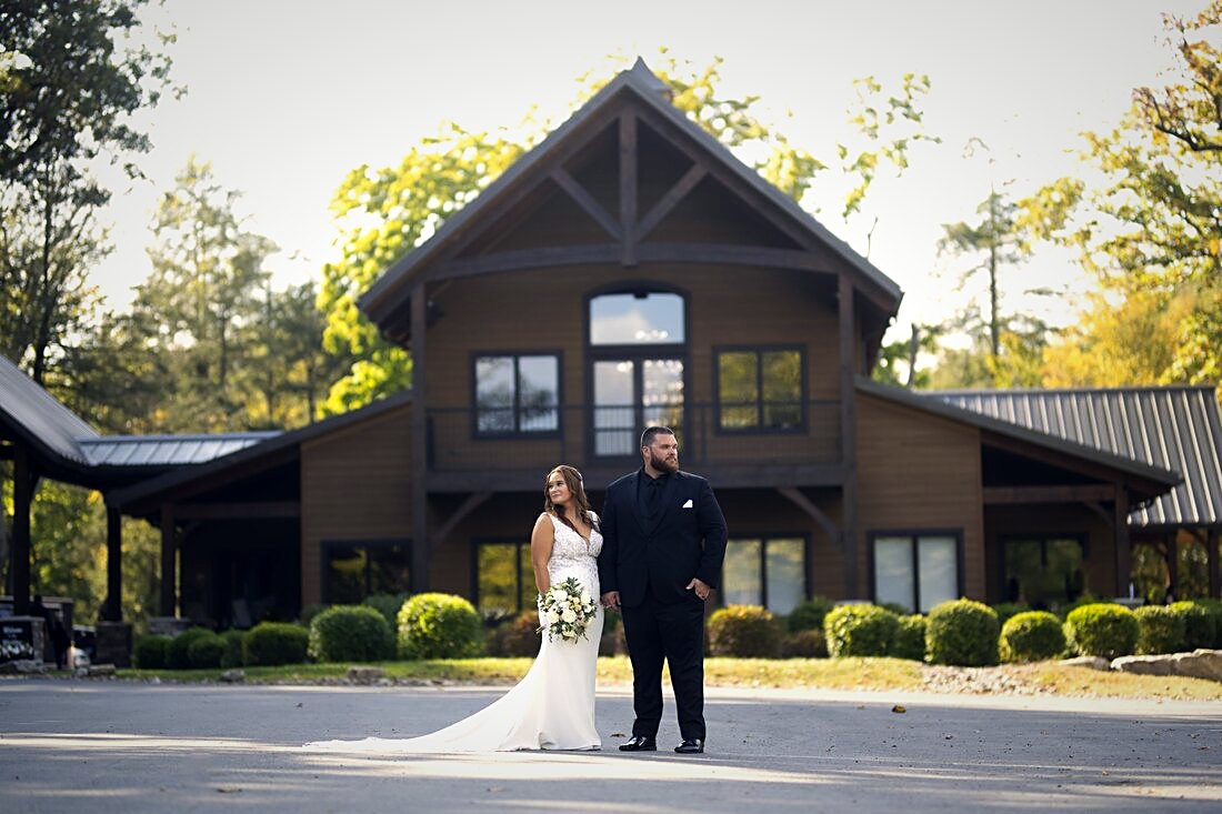 Front elevation of the venue with the entry gable, timber brackets, and landscaped approach