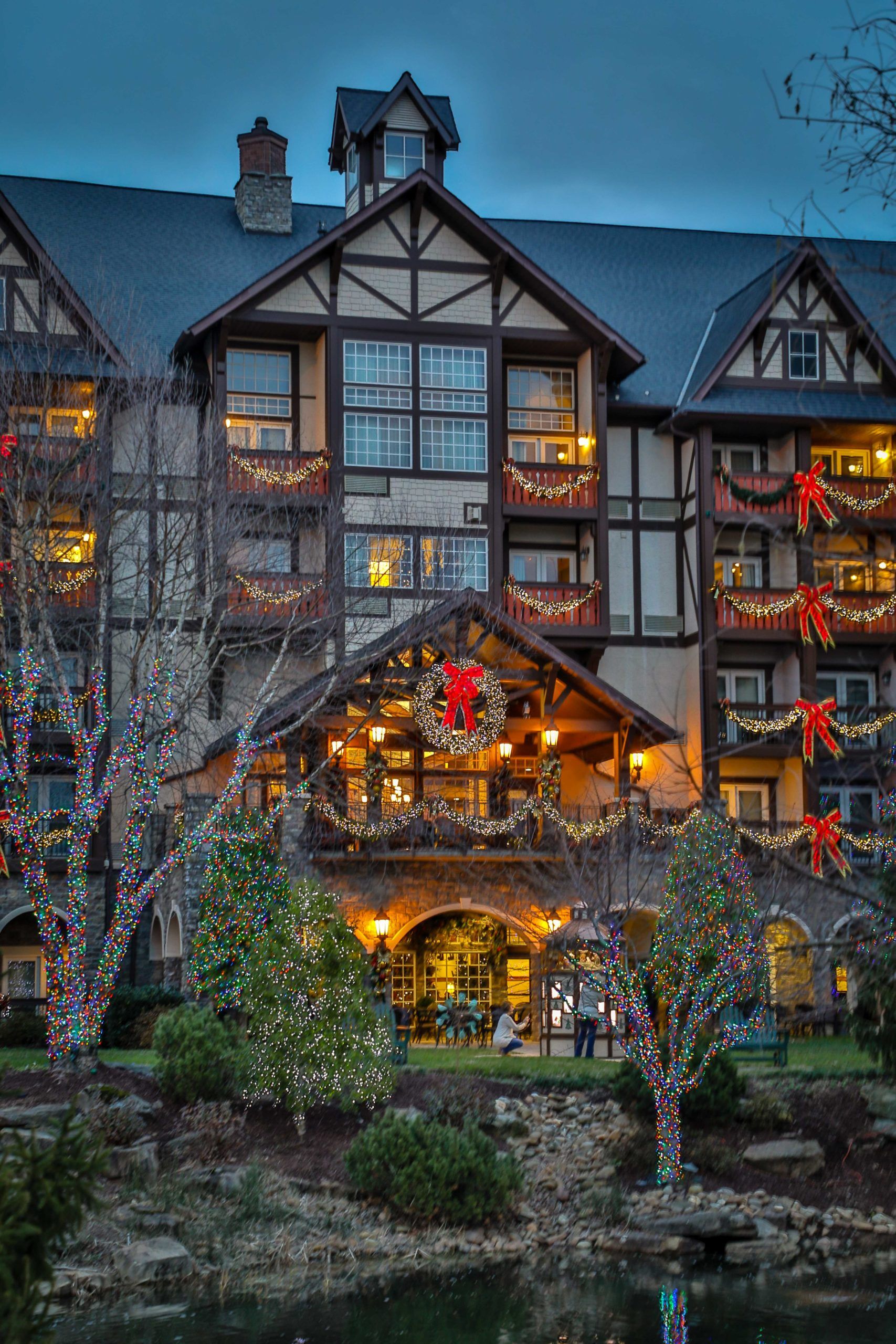 Christmas lights washing the timber facade of The Inn at Christmas Place