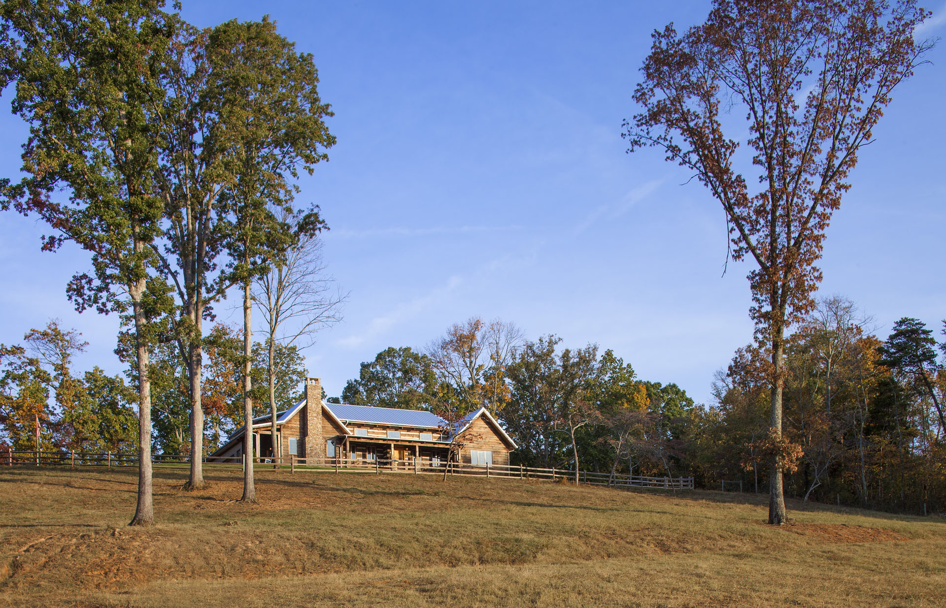 The Tom Thompson, MD Log Home — reclaimed hand-hewn logs, ridgetop pasture, Tennessee