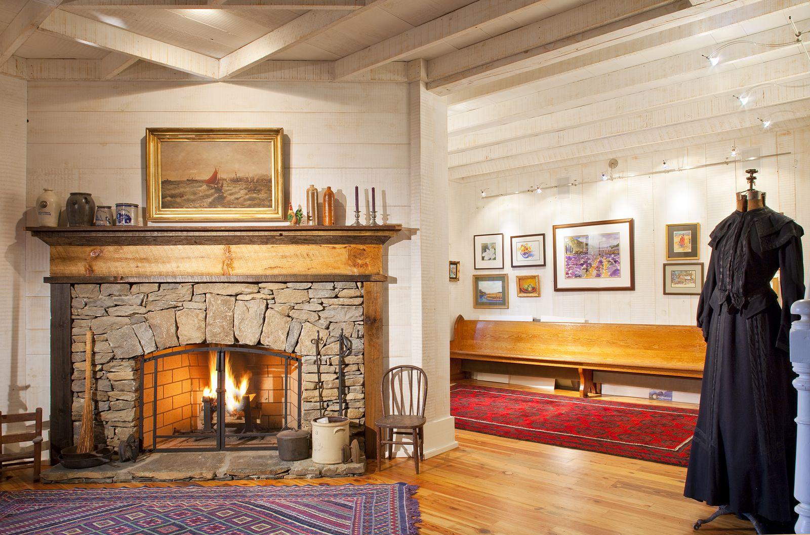 Hughes log home — interior great room with hewn beams