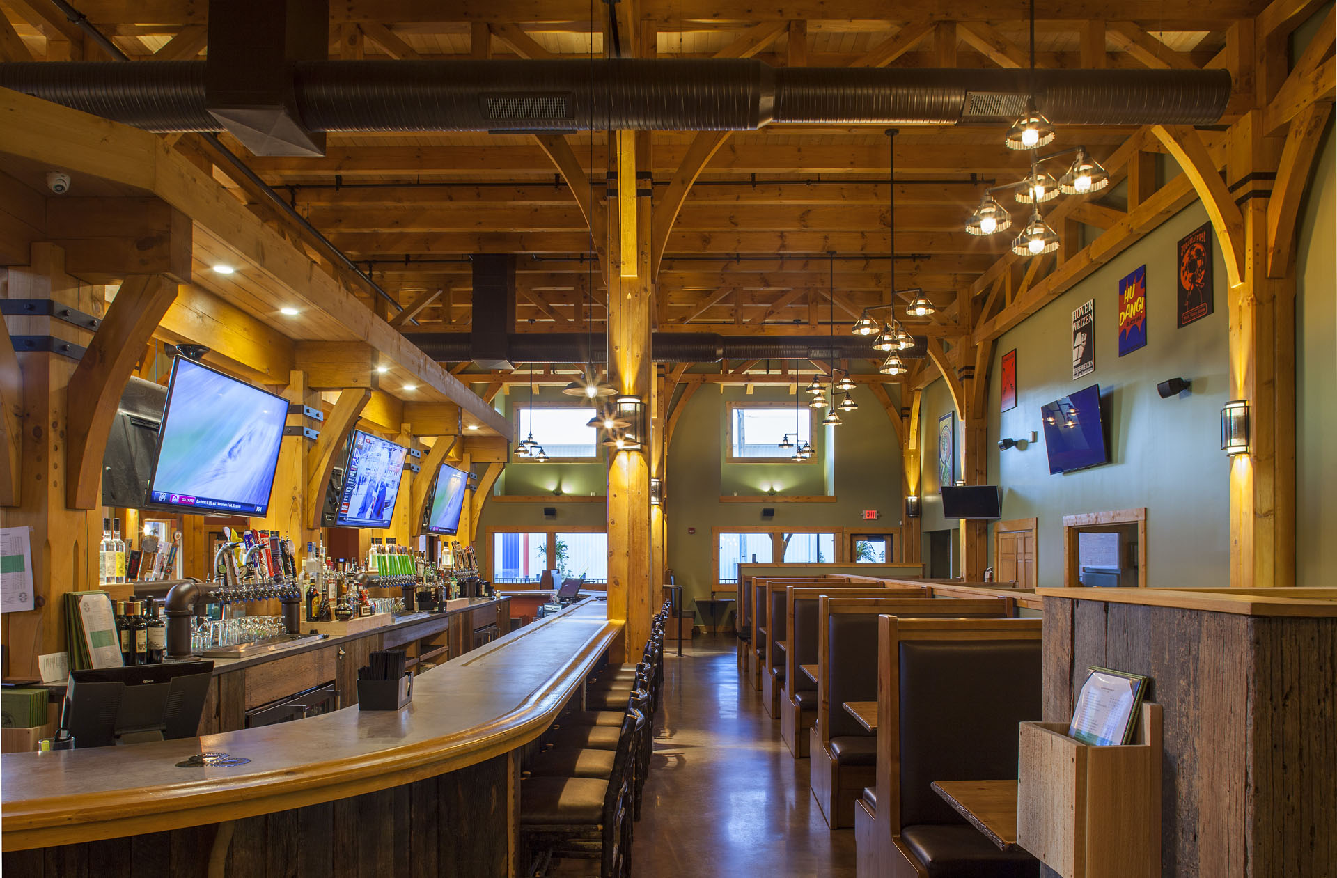 Big Woods Speedway — bar back and taps framed by fir posts