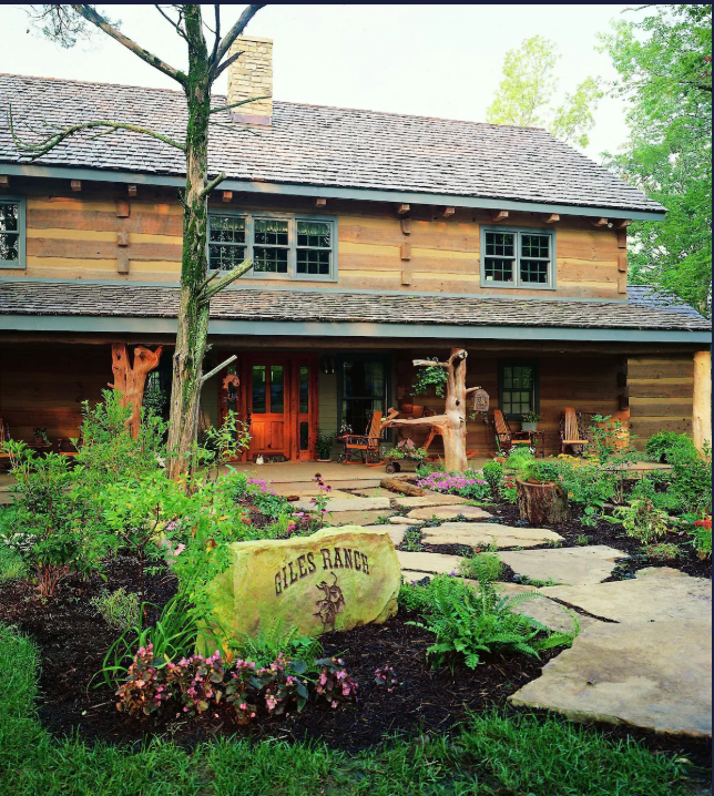 The Hearthstone Luxury Log Home on Douglas Lake at dusk