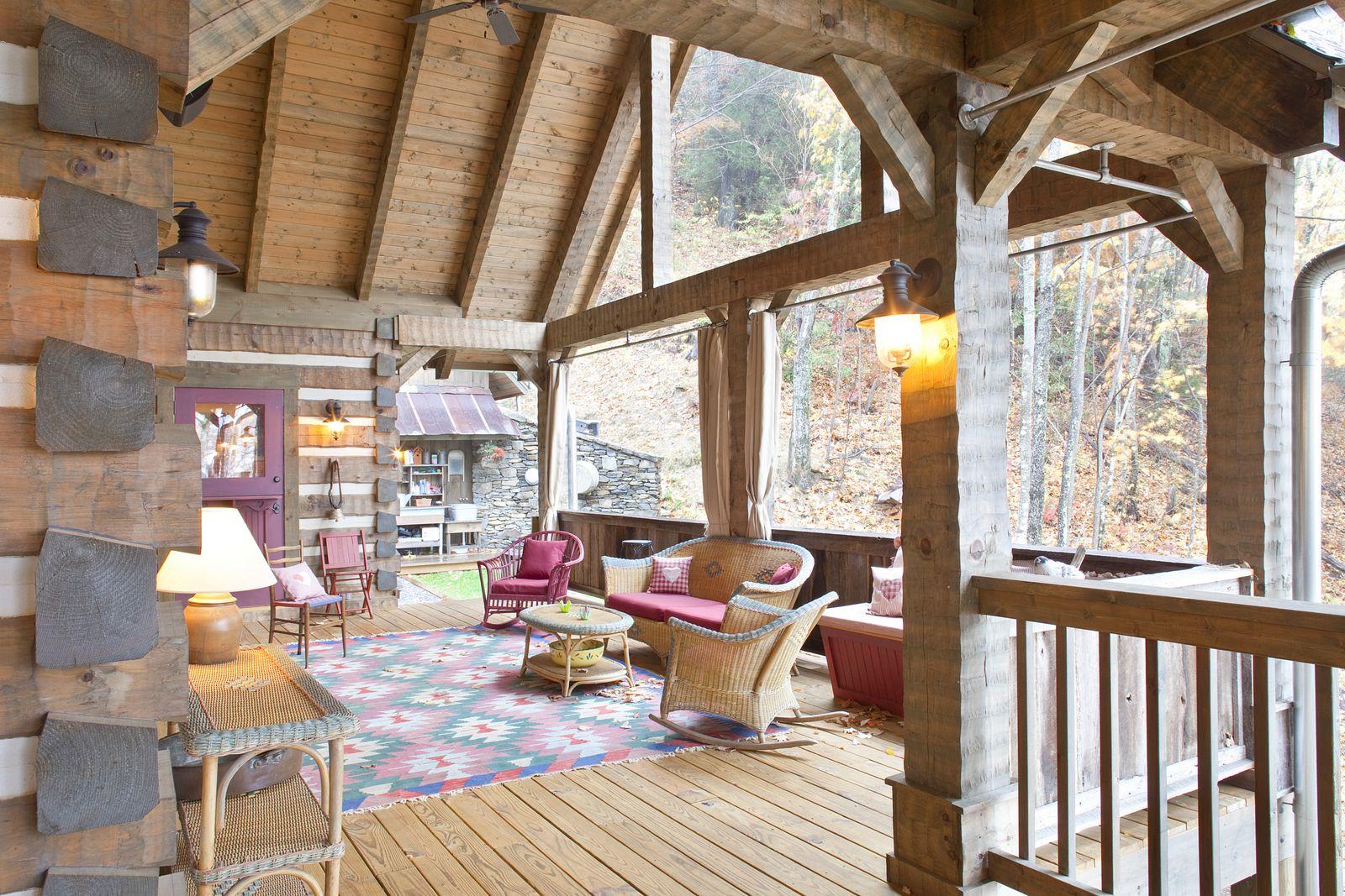 Hughes log home — dining under exposed rafters