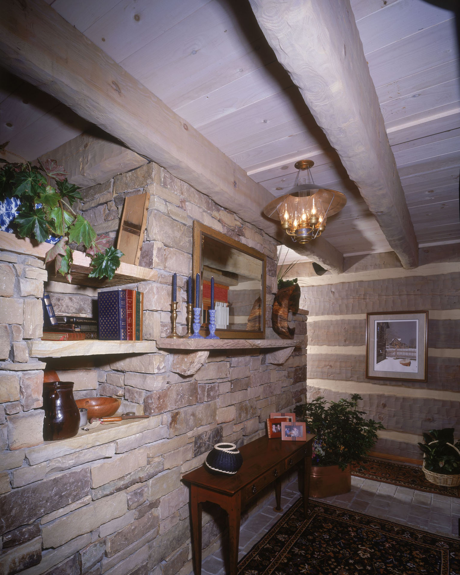 Wide-plank oak floors and hand-hewn log walls, reclaimed from a fire-damaged tavern