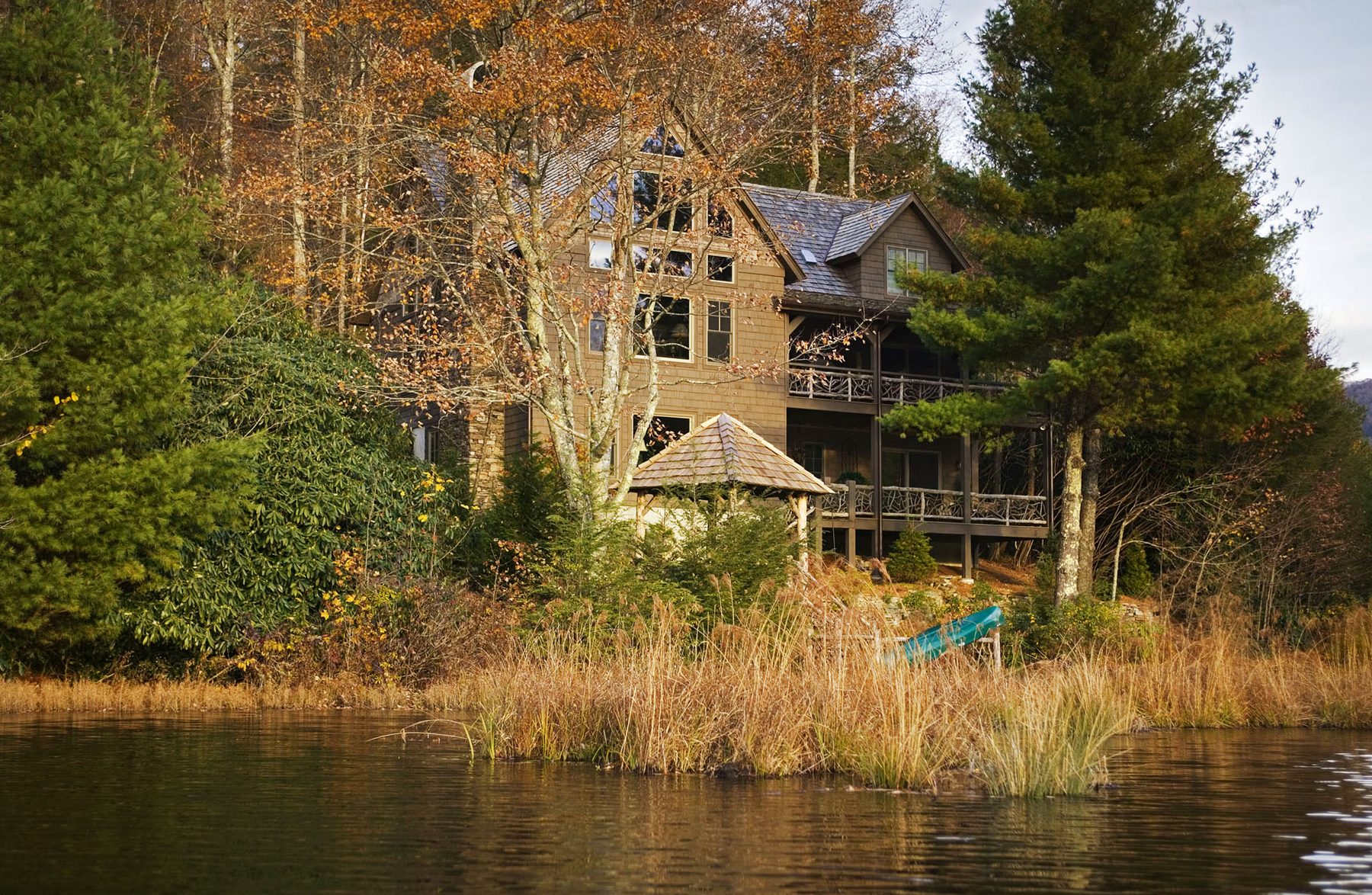Lakefront elevation with the cedar-shake gazebo stepping down toward the water
