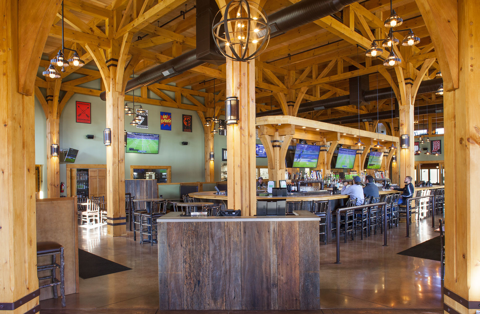 Big Woods Speedway — timber posts marching down the dining hall