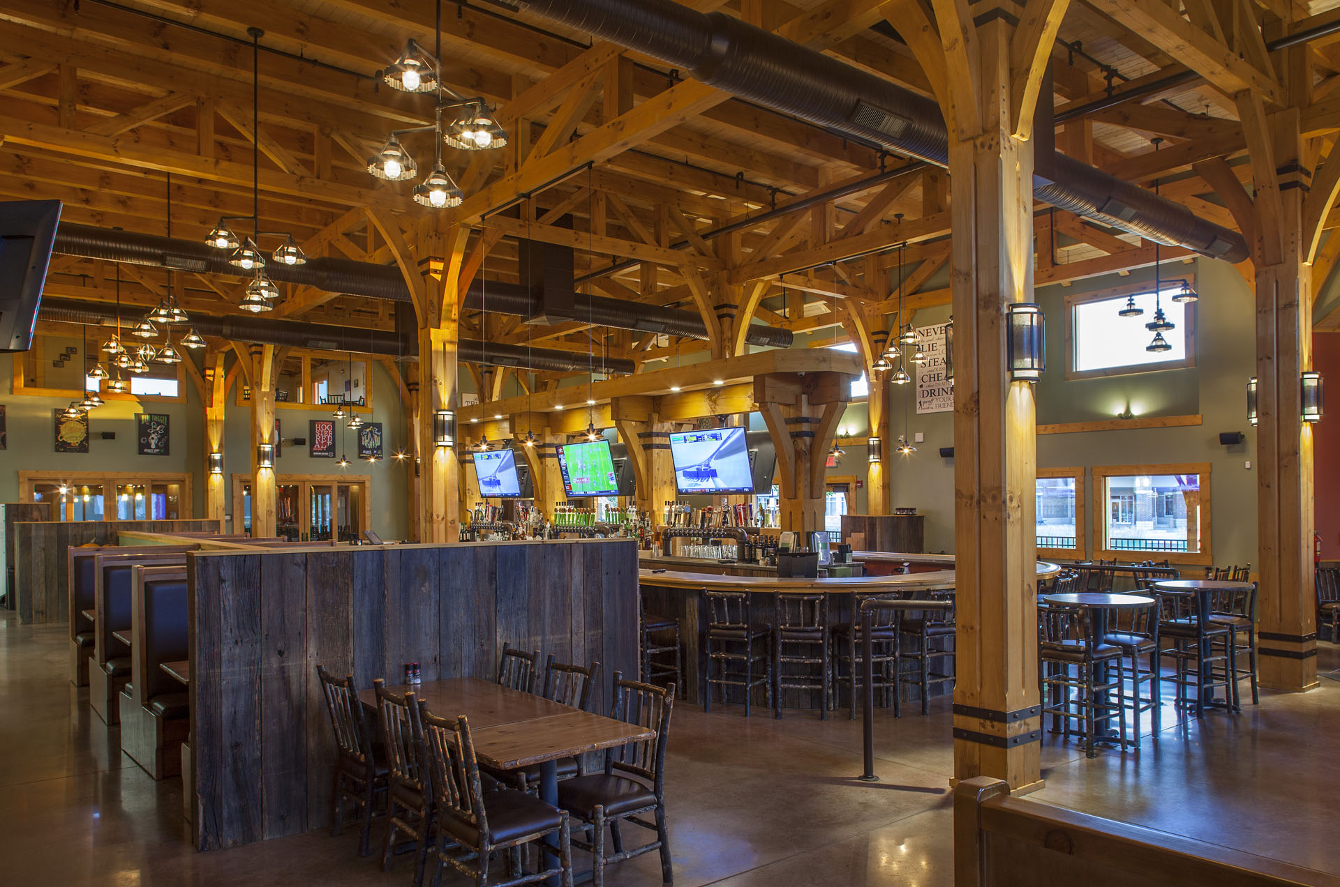 Big Woods Speedway — copper-topped tables under pendant lighting