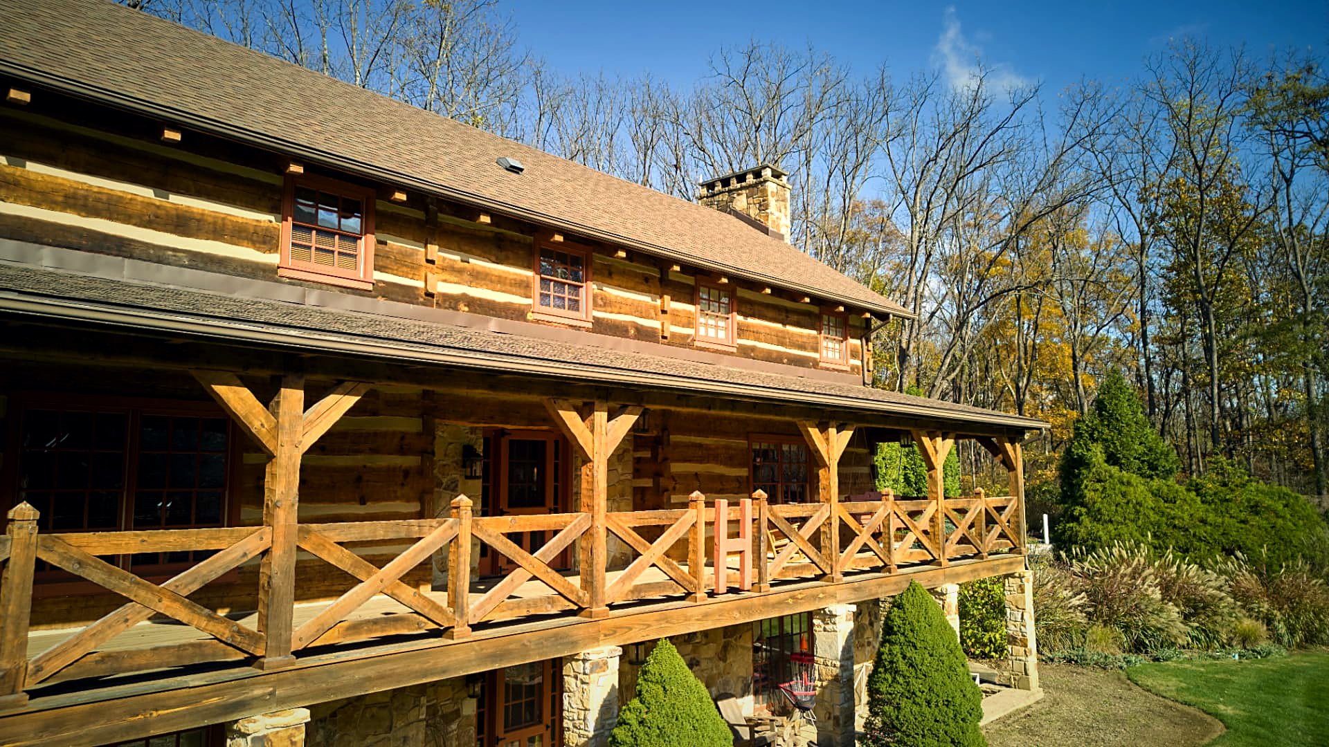 Porch colonnade running the length of the hewn log wall