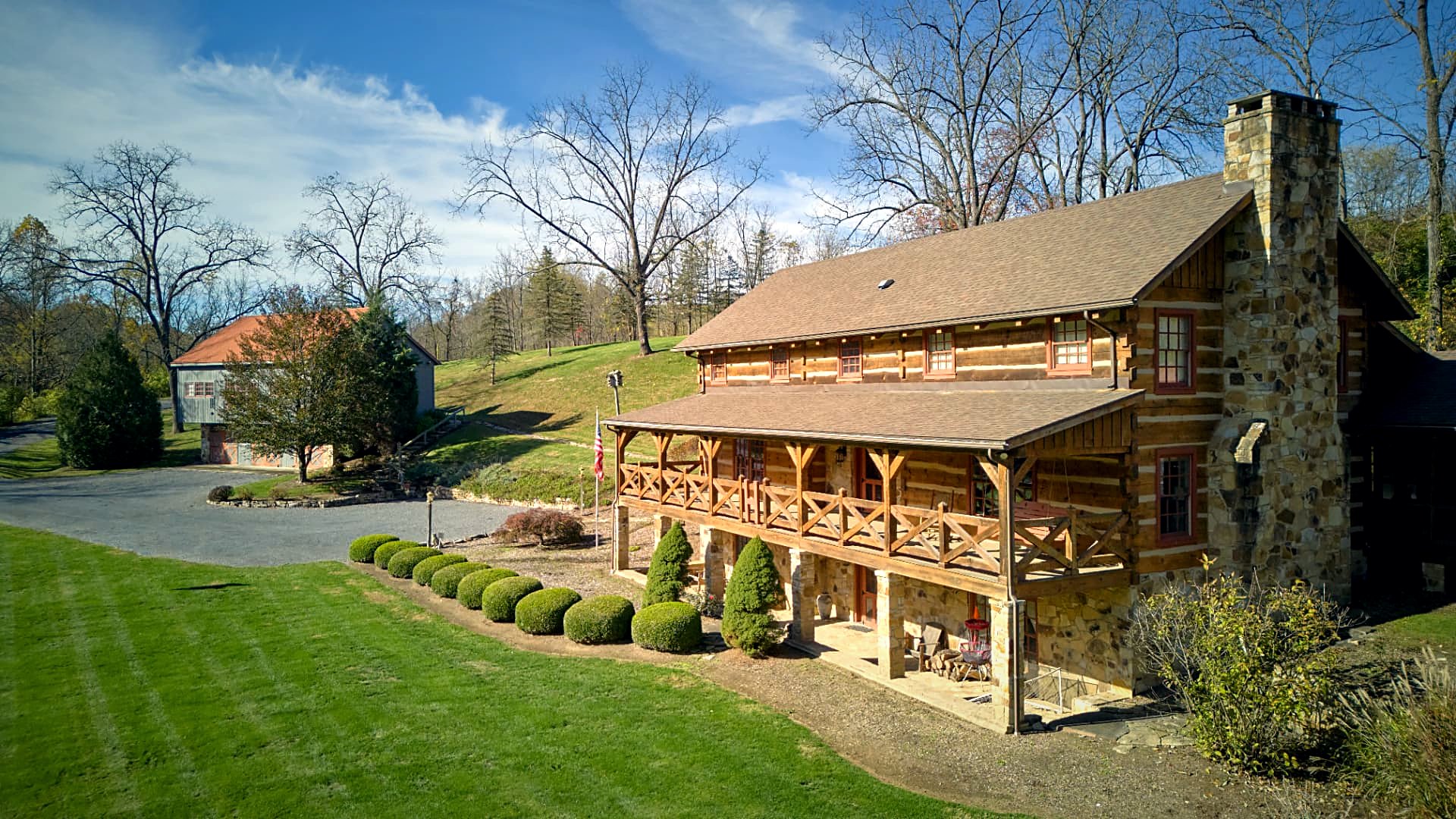 House, flag, and guest cabin in one frame
