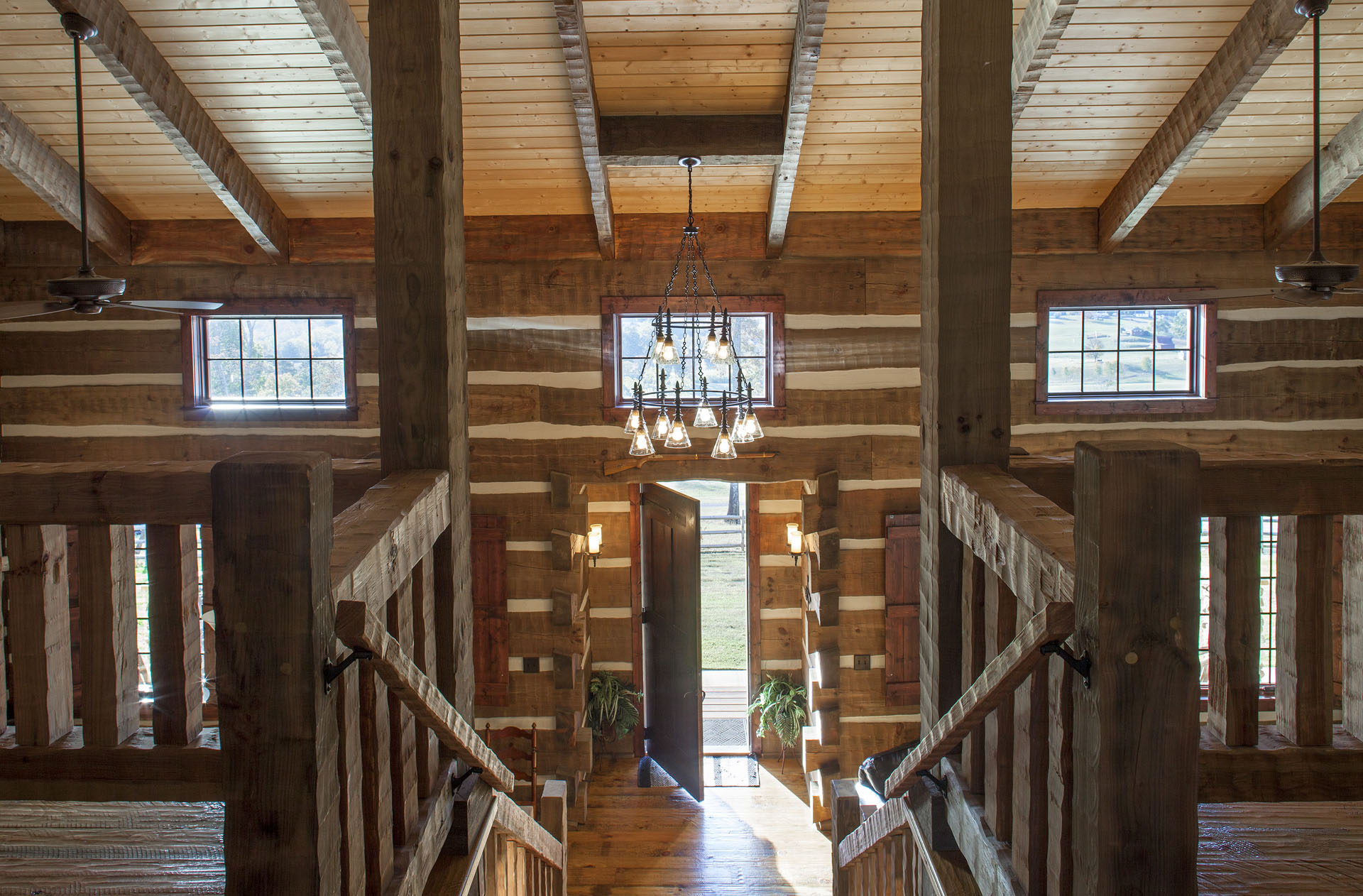 The Tom Thompson, MD Log Home — reclaimed hand-hewn logs, ridgetop pasture, Tennessee