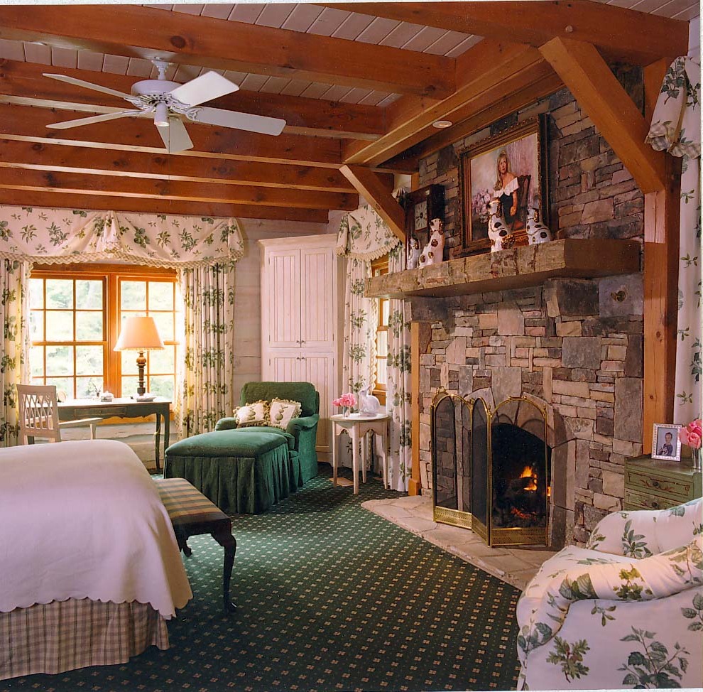 Jones Timberlake® — primary bedroom with stone fireplace