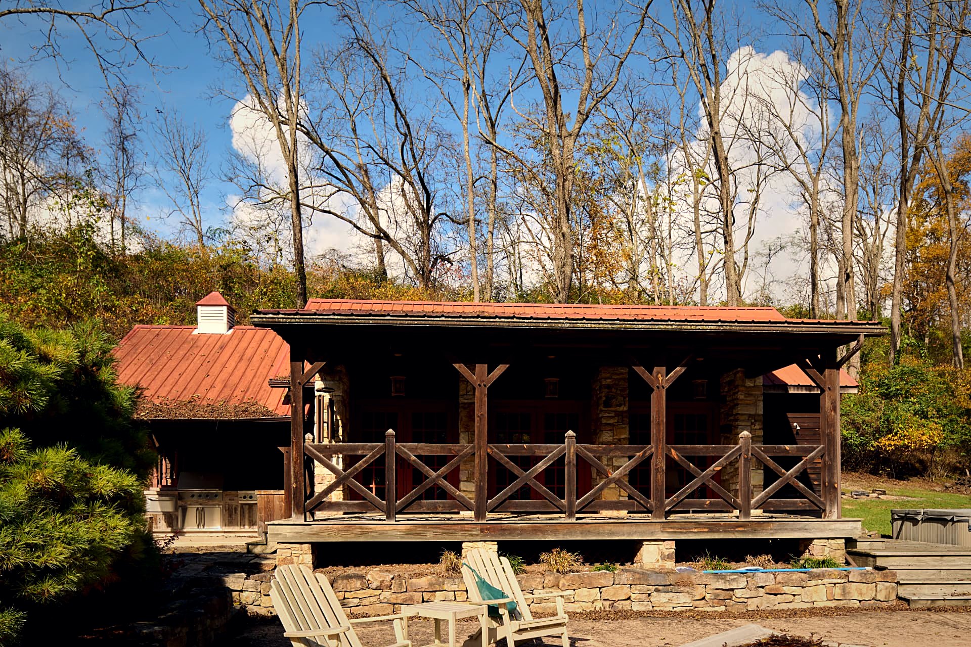 Guest cabin porch with Adirondack chairs facing the ridge