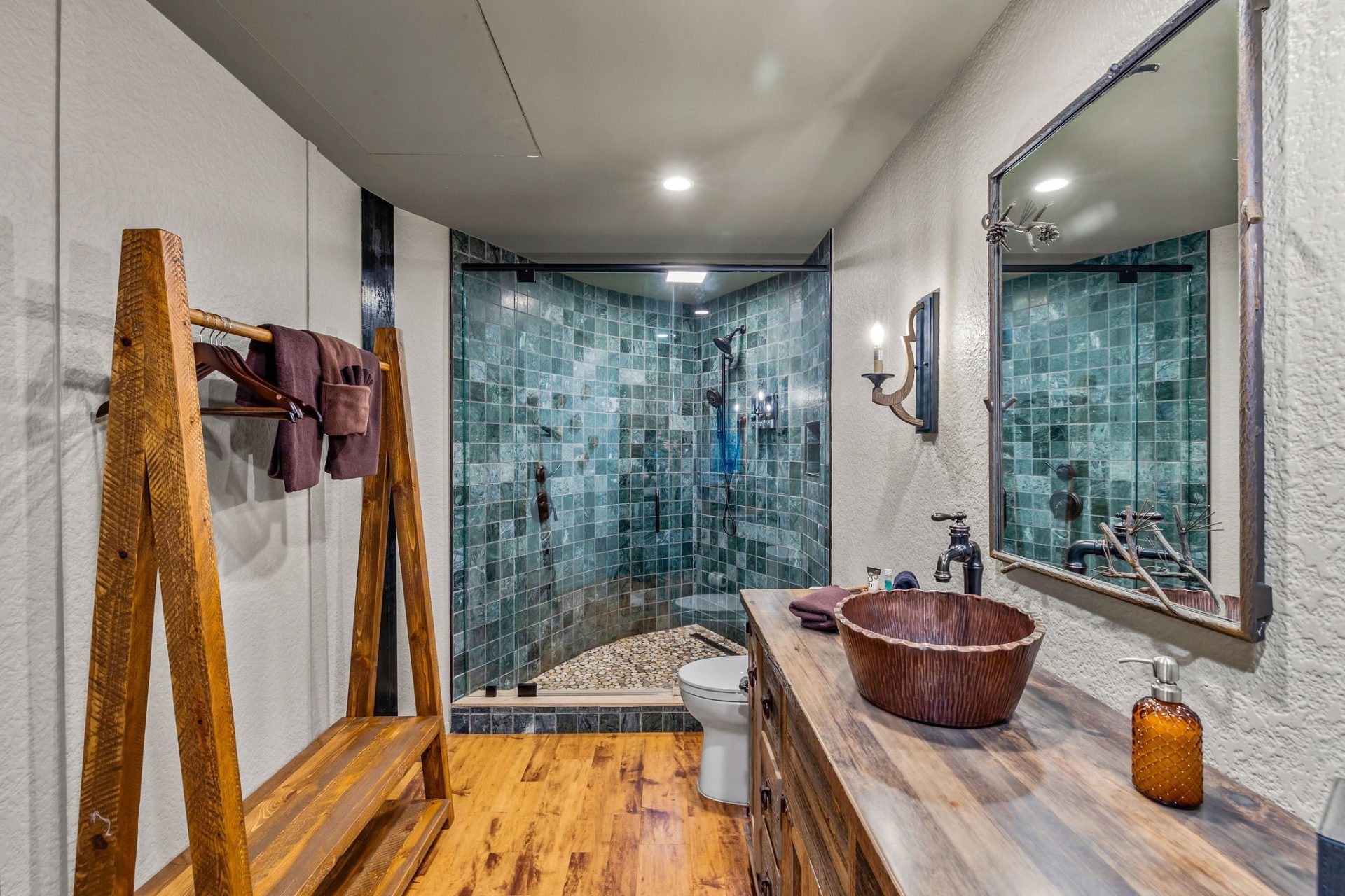 Elven Treehouse bathroom with wooden vanity, vessel sink, and glass shower