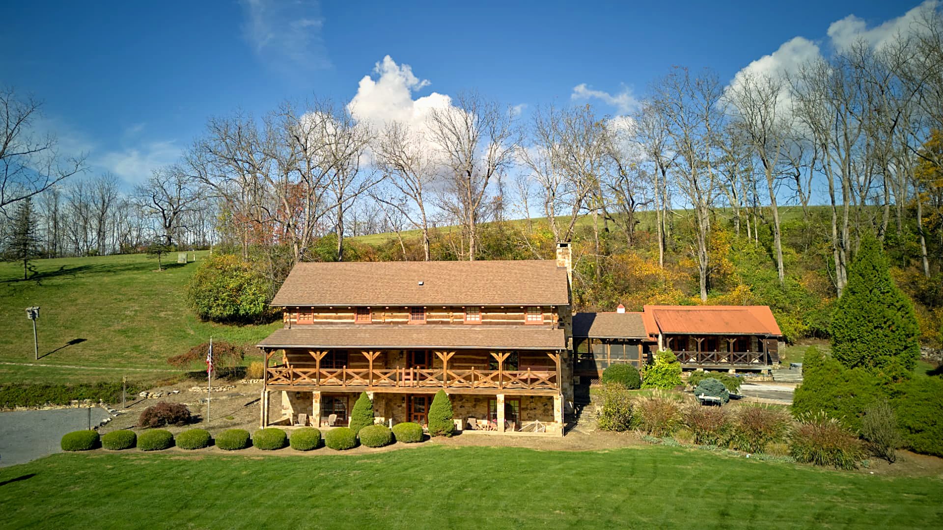 Long-range aerial — wood siding against stone foundations