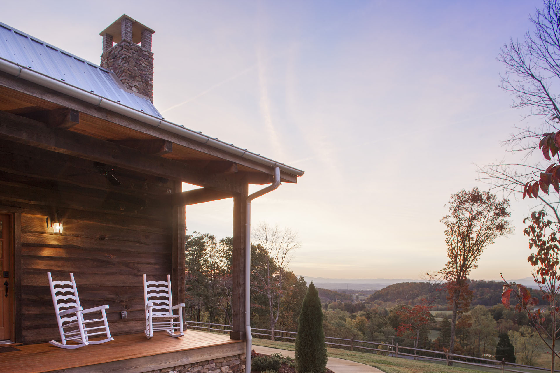 The Tom Thompson, MD Log Home — reclaimed hand-hewn logs, ridgetop pasture, Tennessee