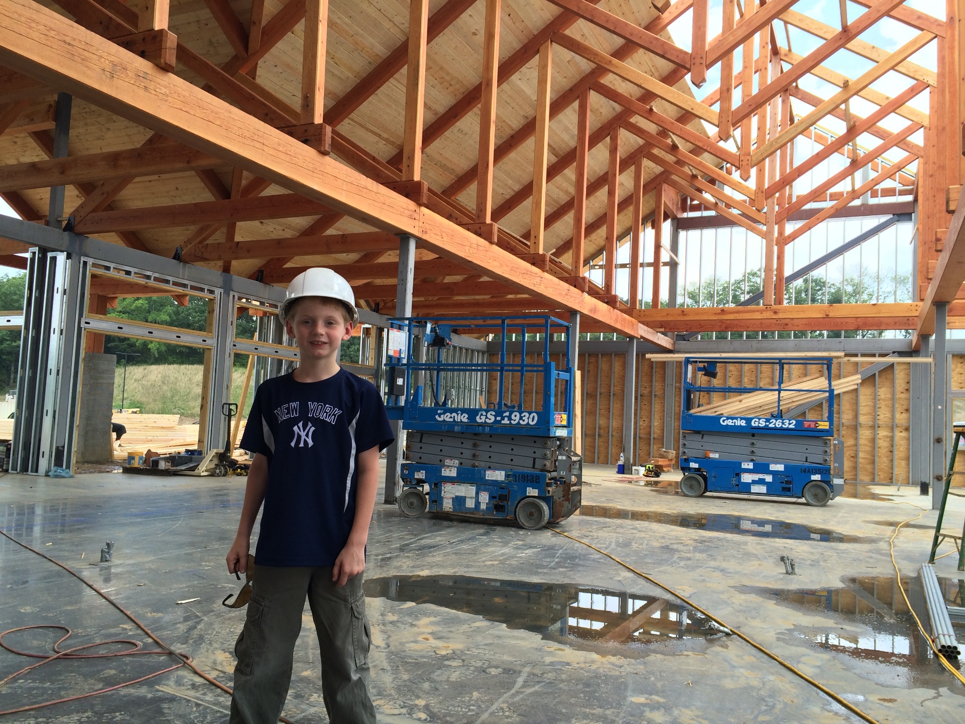 Jack Hall, age 8, under the Douglas fir trusses during construction of The Ripken Experience, 2015